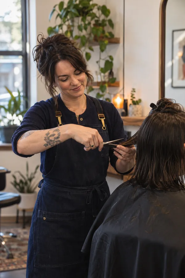 Stylist cutting a customer's hair